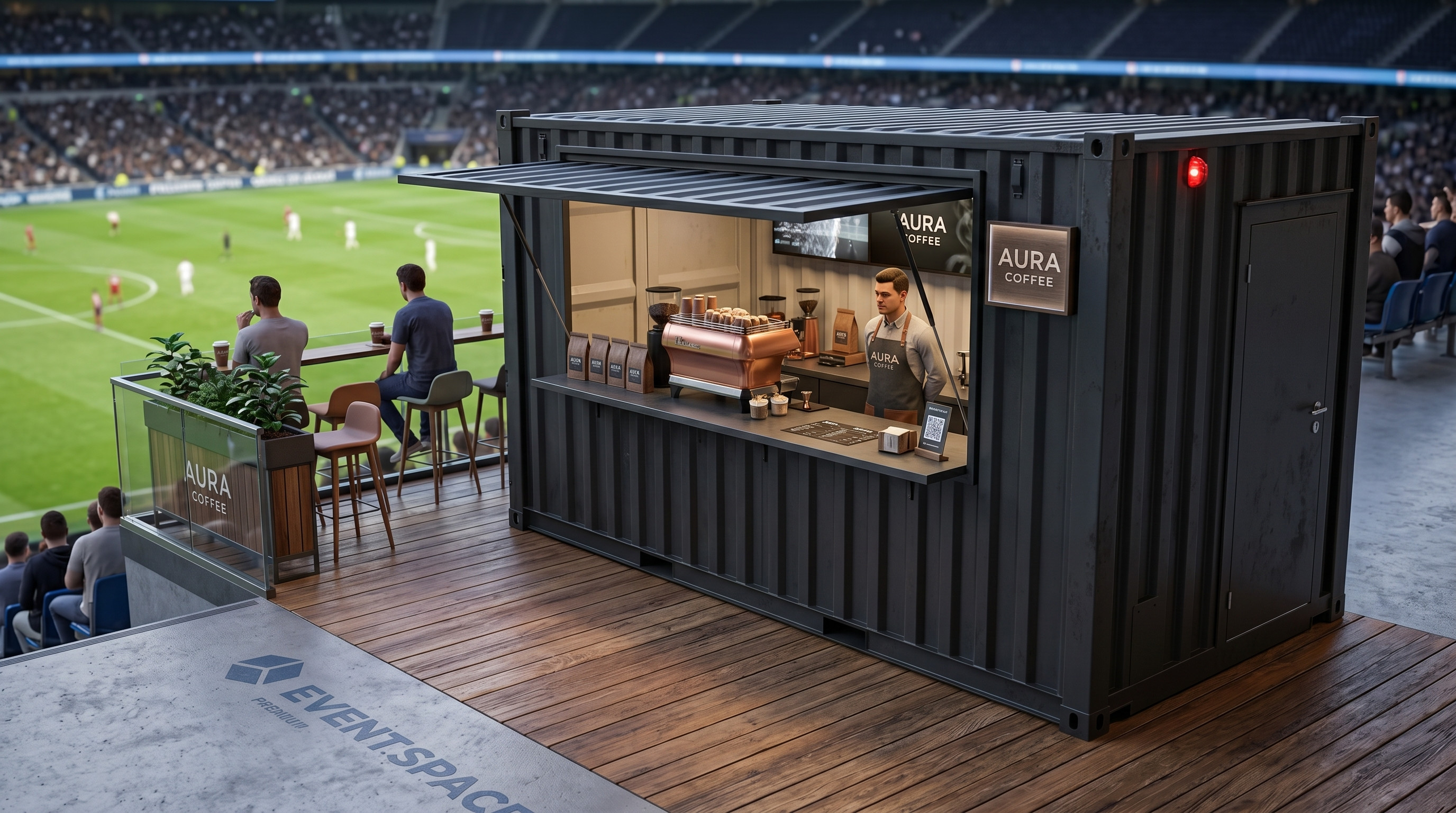 Ein anthrazitfarbener 20-Fuß-Gastro-Seecontainer namens Aura, umgebaut zu einer modernen Kaffeebar mit Holzterrasse in einem Fußballstadion. Ein Barista arbeitet hinter dem Tresen mit einer kupferfarbenen Espressomaschine.